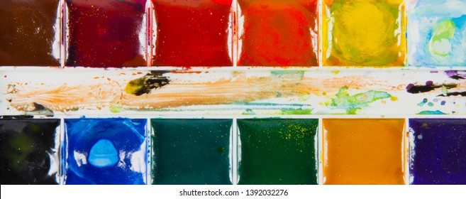 A set of children's paints in rectangular forms close-up