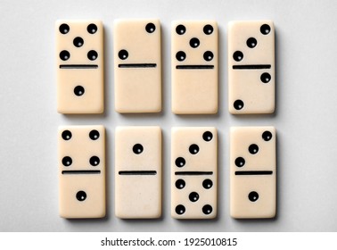 Set of classic domino tiles on white background, top view