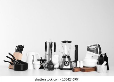 Set of clean cookware, dishes, utensils and appliances isolated on white - Shutterstock ID 1354246904