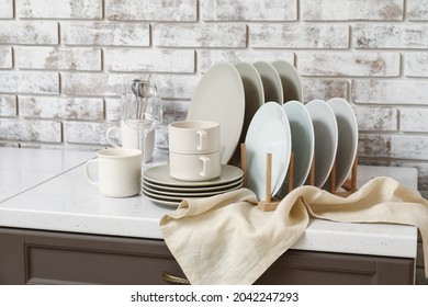 Set of clean dishes on counter in kitchen