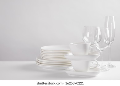 Set Of Clean Dishes On White Table