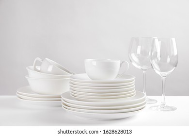 Set Of Clean Dishes On White Table