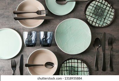 Set Of Clean Tableware On Grey Background