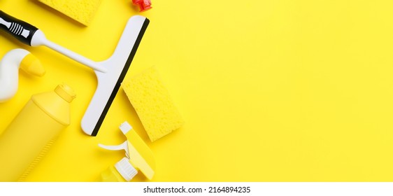 Set cleaning supplies yellow background and space for text