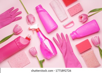 Set of cleaning supplies and spring flowers on color background - Powered by Shutterstock