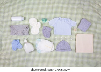 Set Of Clothing And Body Care Supplies For Newborns. Collect The Bag In The Maternity Hospital. Accessories For Baby Care. Top View