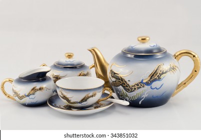 Set of coffee. Cup, sugar bowl, milk jug and coffee pot. Blue-eyed, golden dragon pattern.