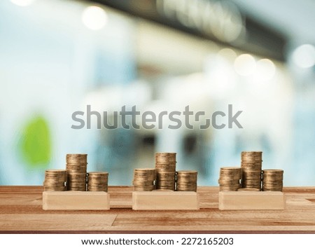 Set of coins and wood block for investment concept