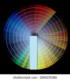 A set of color reference books.  All the colors of the rainbow. Many shades. Label for text. Black background