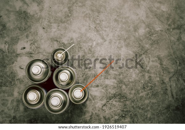 set of color spray bottles or car\
polish spray on Concrete background ,With space for\
text
