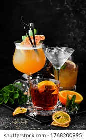 Set Of Colored Alcoholic Cocktails On A Black Stone Background. Menu Bar. Alcohol.