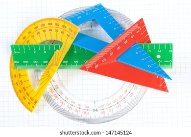 A set of colored triangles and lines protractors for drawing. On a white background.