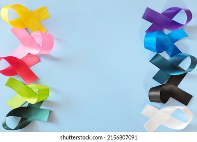 Set of colorful cancer awareness ribbons flat lay in blue background. World Cancer Day concept.	 - Shutterstock ID 2156807091