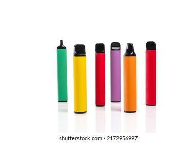 Set of colorful disposable electronic cigarettes of different shapes on a white background. The concept of modern smoking.