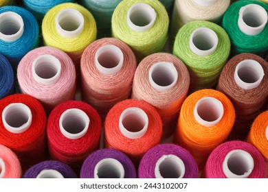 Set of colorful spools of thread close up