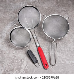 Set of cooking products including strainer spoon, fruit basket strainer, cooking basket strainers, splatter screen. These are very useful kitchen stuffs for women. 