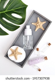 Set Of Cosmetic Product  - Glass Container With Sponge And Sea Star, Shell, Green Sheet On Wooden Board. Skin Care Lotion. Wellness And Spa. Sea Beautiful Spa Skin Care Product.
