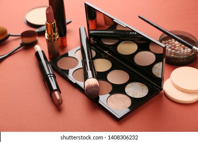 Set of cosmetics for contouring makeup on color background