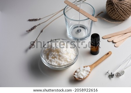 Set for crafting candle. Eco soy wax on white table. DIY candle. Hobby concept