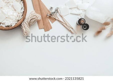 Set for crafting candle on white background. Eco soy wax and candle making tools top view, flat lay. DIY candles. Hobby concept.