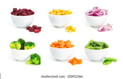 Set Of Cut Vegetables In A Bowls Isolated On White Background