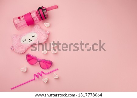 set of cute kawaii accessory for young girl in pink color, sunshine summer concept, trendy lama and candy pink closeup