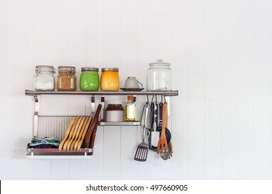 Set Of Cutlery Hanging On Wall In The Kitchen