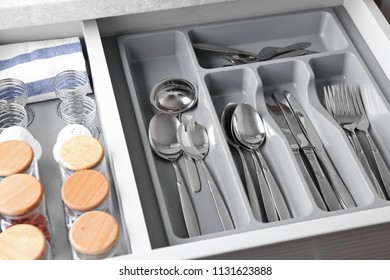 Set of cutlery in kitchen drawer, closeup - Shutterstock ID 1131623888