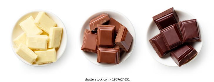 Set of dark, white and milk chocolate pieces in bowl isolated on white background, top view - Powered by Shutterstock