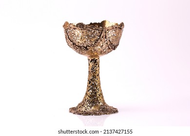 A set of decorative antique silver goblets. Isolated on white.