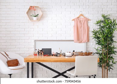 Set of decorative cosmetics and beauty accessories on dressing table indoors
