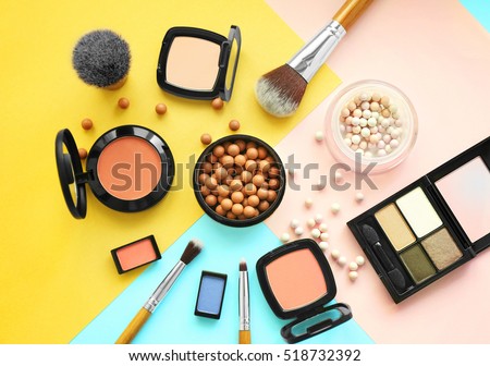 Set of decorative cosmetics on color background