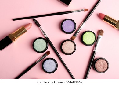 Set of decorative cosmetics on light colorful background