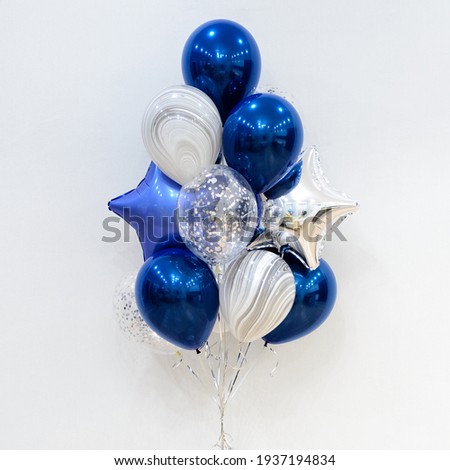Set of deep blue and silver helium balloons