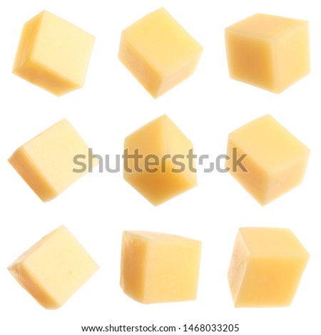 Set of delicious cheese cubes on white background