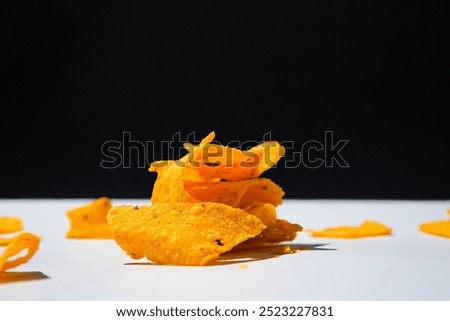 Set of delicious mexican nachos chips. Corn chips,triangle, nachos. Pile of tortilla chips isolated.