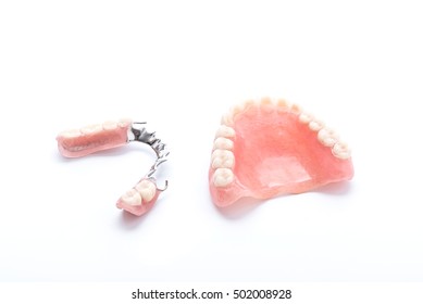 Set of dentures on white background
