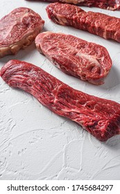 Set Of Denver, Top Blade, Tri Tip Steak, Machete, Flank, Bavette London Broil Marble Beef On White Background Side View Close Up Space View