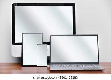 Set of devices desktop computer display, laptop, tablet and smartphone mockup template