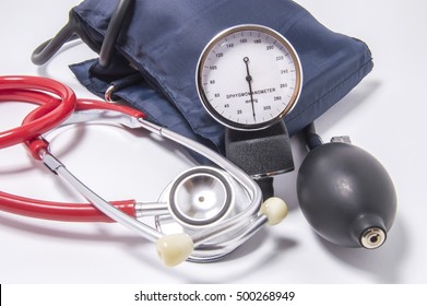 Set of diagnostic kit for determining increased blood pressure for doctors of cardiology, internal medicine, therapeutics, including red stethoscope, sphygmomanometer, bulb and inflated cuff close up