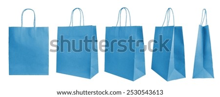 Set of different angles, various perspectives blank blue craft paper bags isolated on white background. Eco friendly shopping bag made from recycled paper, recycling concept. Mockup, template