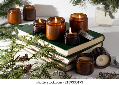 A set of different aroma candles in brown glass jars. Scented handmade candle. Soy candles are burning in a jar. Aromatherapy and relax in spa and home. Still life. Fire in brown jar - Shutterstock ID 2139330193