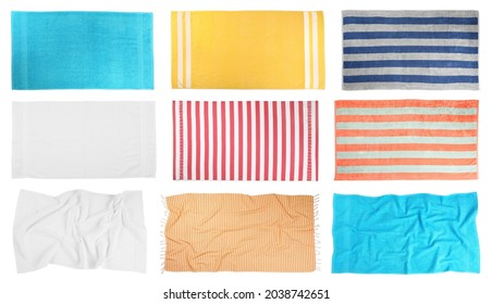 Set with different beach towels on white background, top view
