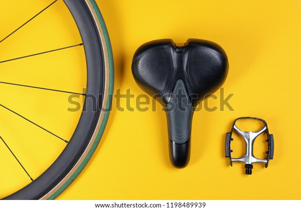 Set of different bicycle parts on color background,\
flat lay