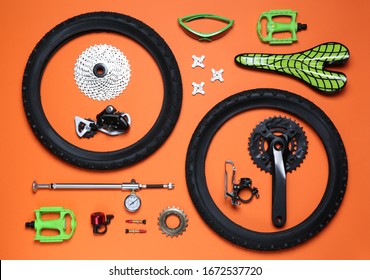 Set of different bicycle tools and parts on orange background, flat lay - Powered by Shutterstock