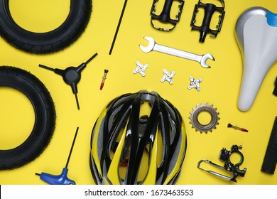 Set of different bicycle tools and parts on yellow background, flat lay - Powered by Shutterstock