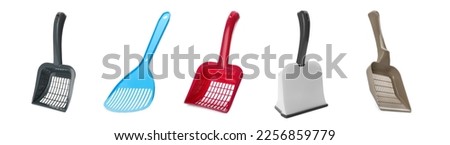 Set with different cat litter scoops on white background