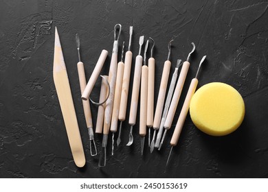 Set of different clay crafting tools and pottery sponge
