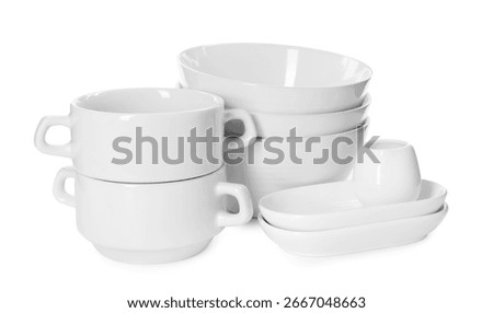 Set of different clean dishware isolated on white