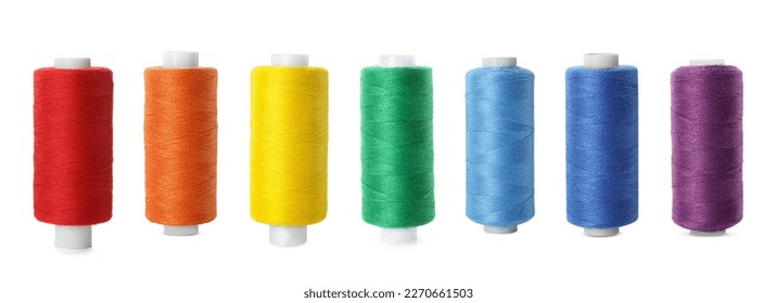 Set of different colorful sewing threads on white background